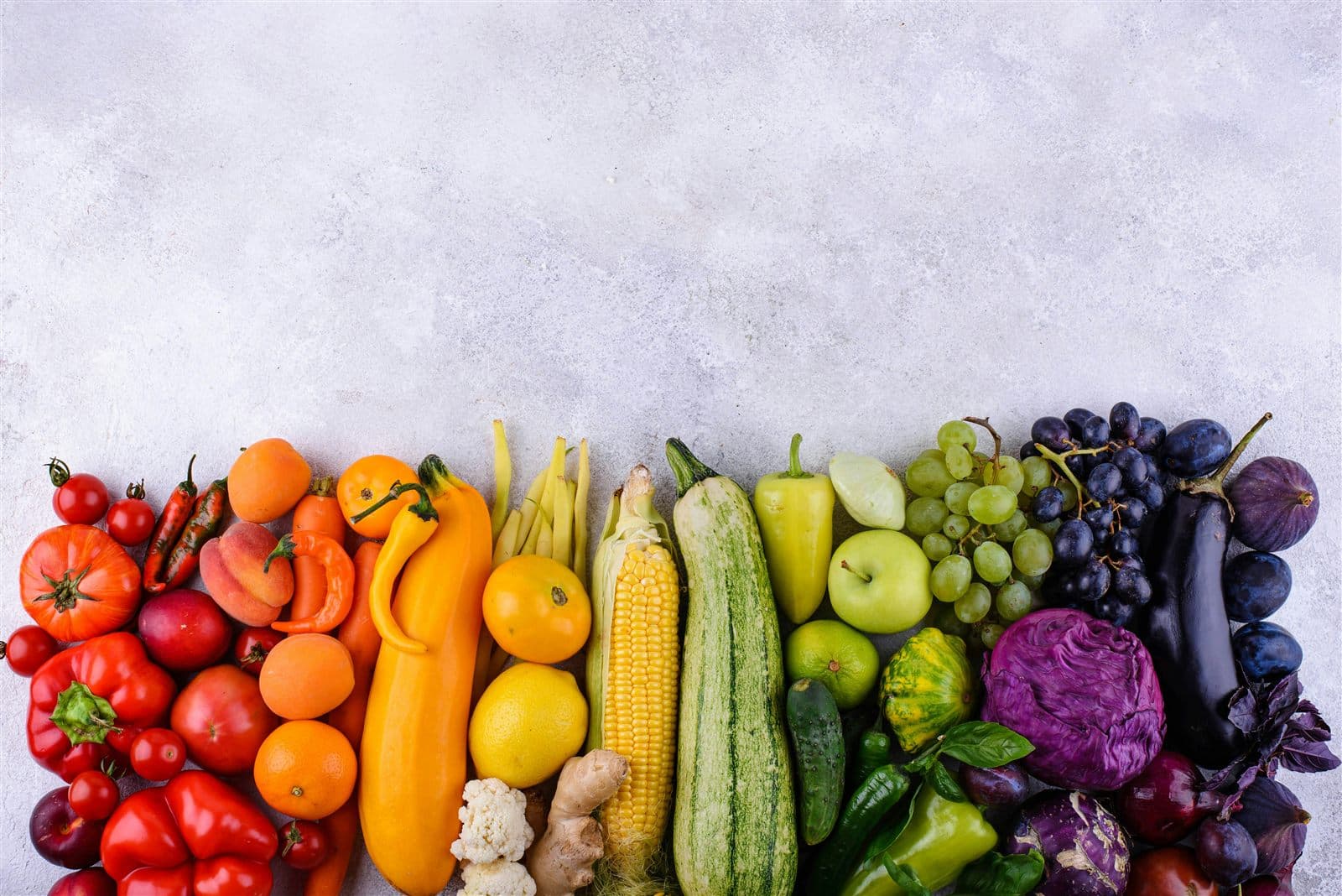 A colourful assortment of red, yellow, green, orange and purple fruit and vegetables